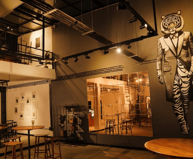 Rainy glass ceiling at Cafe Indistinct Chatter – cozy interior with rain drops